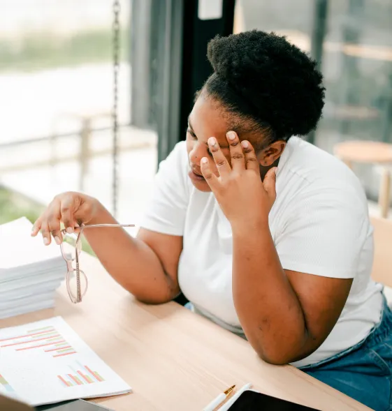 Borrower reviewing financial documents at a desk